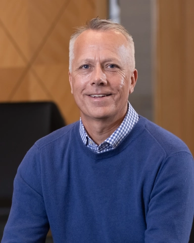 portrait of a smiling person in professional attire